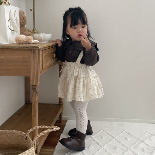 Falda Kang con pompones