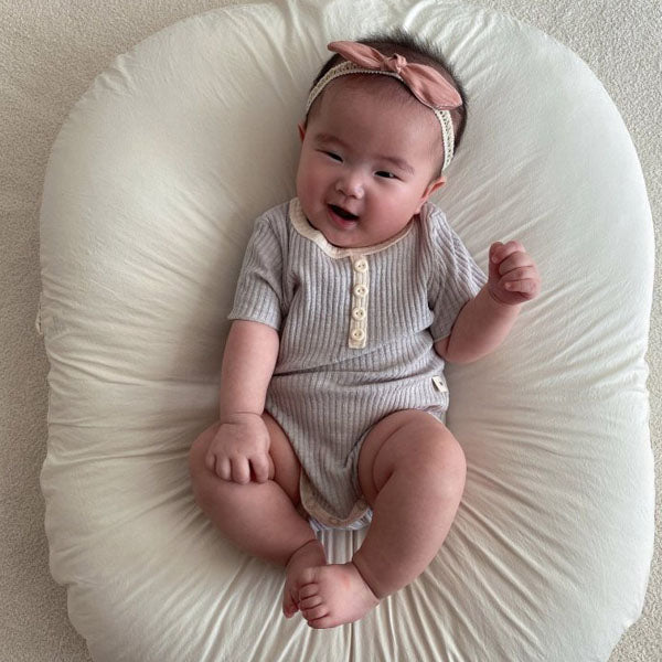 Dove Bodysuit Korean infant bodysuit in cream made in Korea